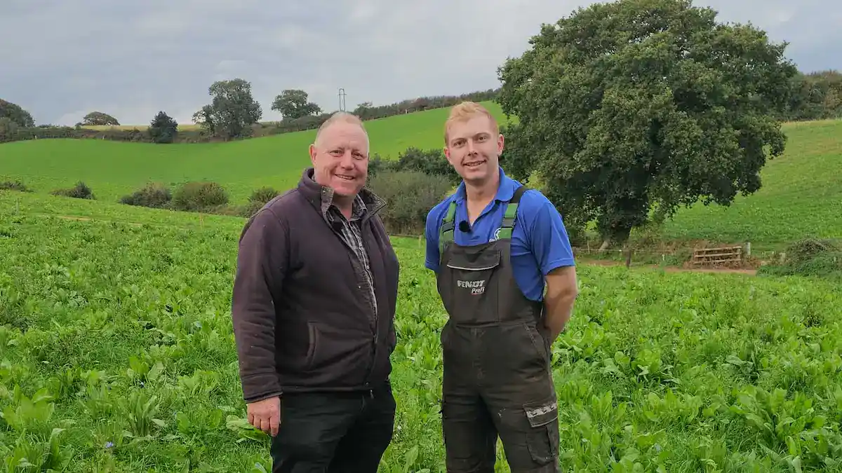 Henry and Peter Wastenage standing in a mixed species sward on their Devon dairy farm